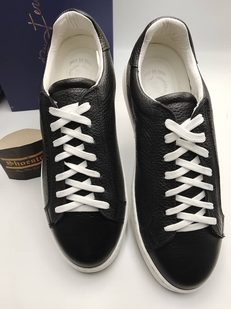 Black wrinkled leather sneakers with white lace-up